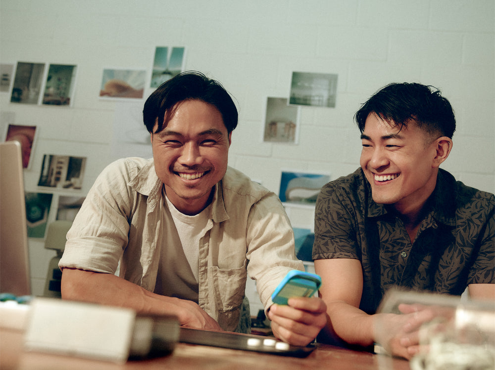 Neuro co-founders smiling together at a desk